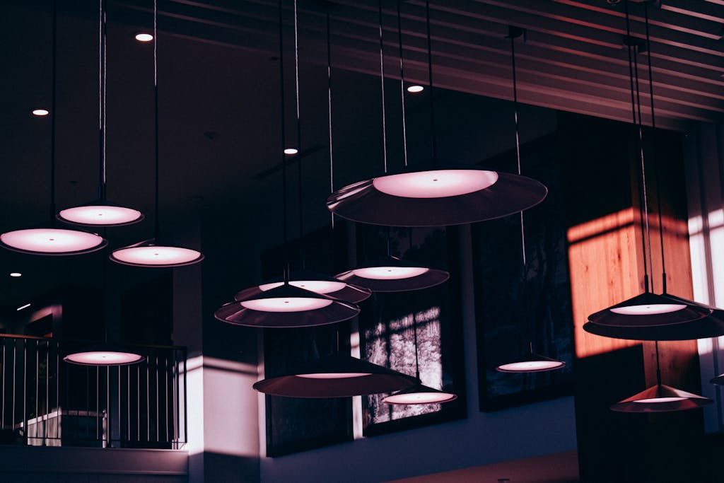 A contemporary café interior with artistic lighting design and moody ambiance.